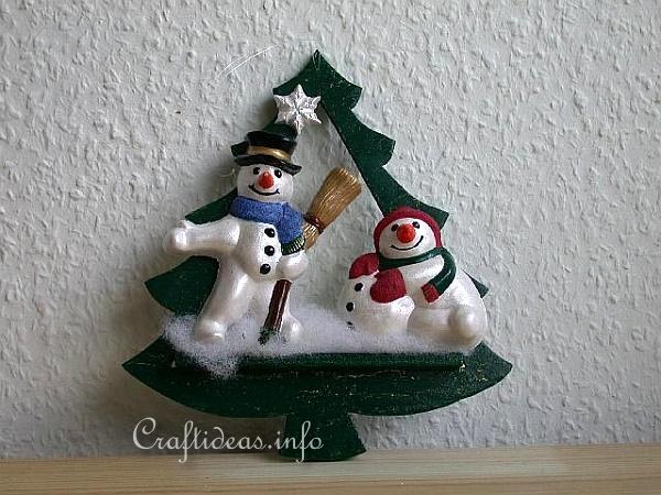 Christmas Decoration With Wood Tree and Plaster of Paris Snowmen