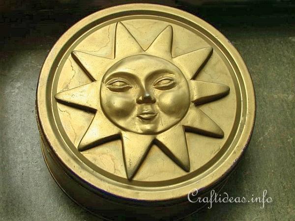 Recycling Craft for Summer - Gold Cookie Tin with Plaster of Paris Sunshine Motif